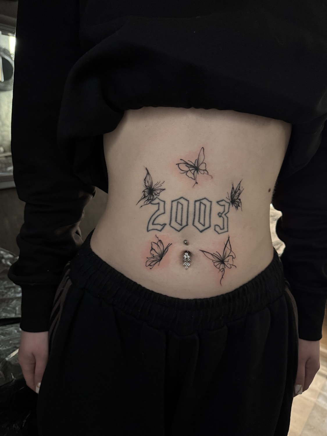 Fineline Schmetterlinge mit Lettering 2003 am Bauch